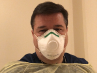 Male nursing wearing mask.